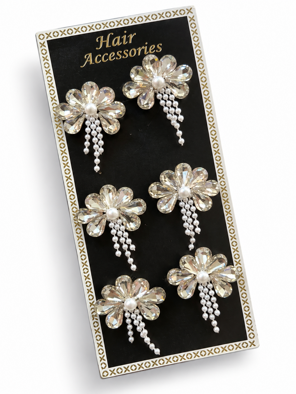 Clear crystal flower hair stickers with pearl centres displayed on a black card