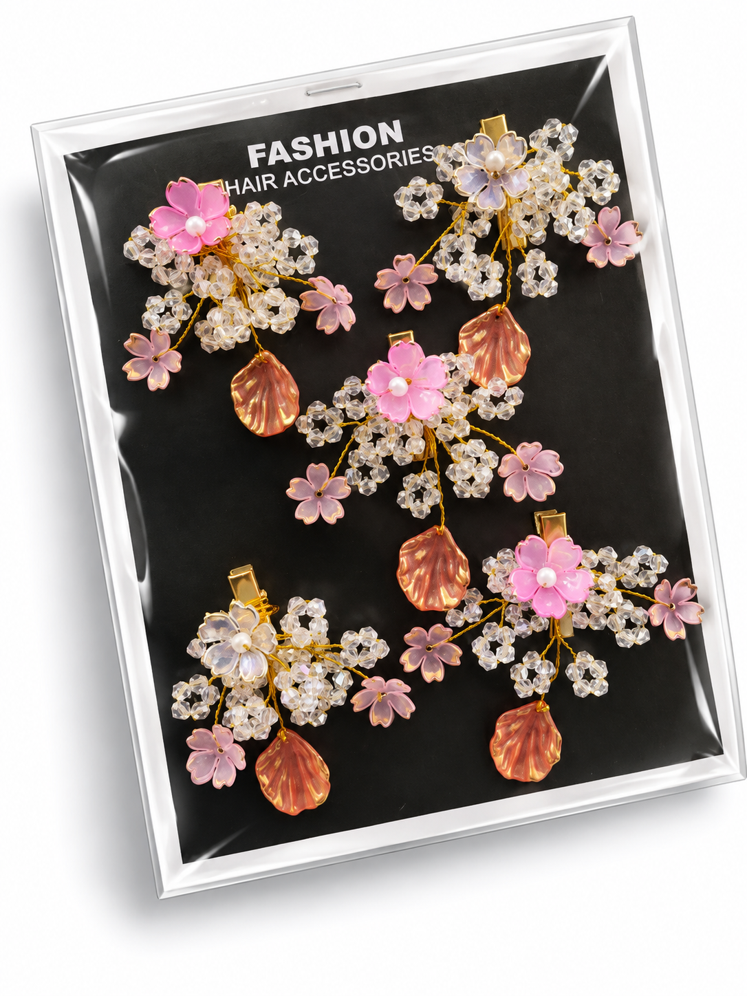 Floral crystal hair accessories with pink and ivory flowers, clear crystal sprays and peach shell charms on a black display card