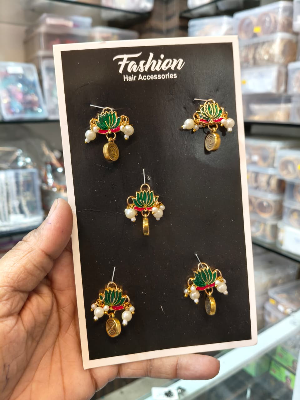 Set of five green and red lotus hair pins with pearl accents and gold-tone dangling details