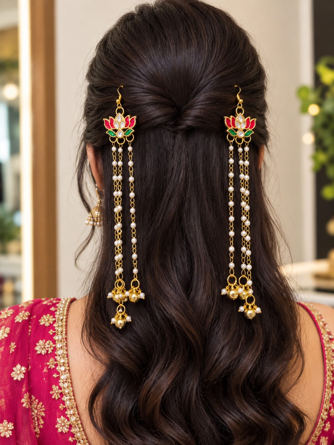 Pair of gold-tone lotus floral hair ornaments with red and green accents, pearl strands and dangling gold beads