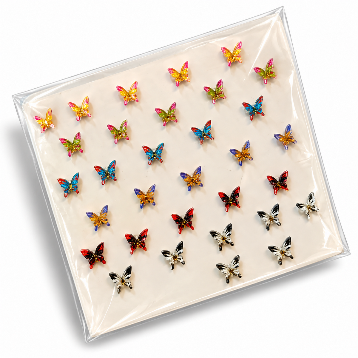 Pack of multicolour butterfly hair stickers in clear packaging on a light background