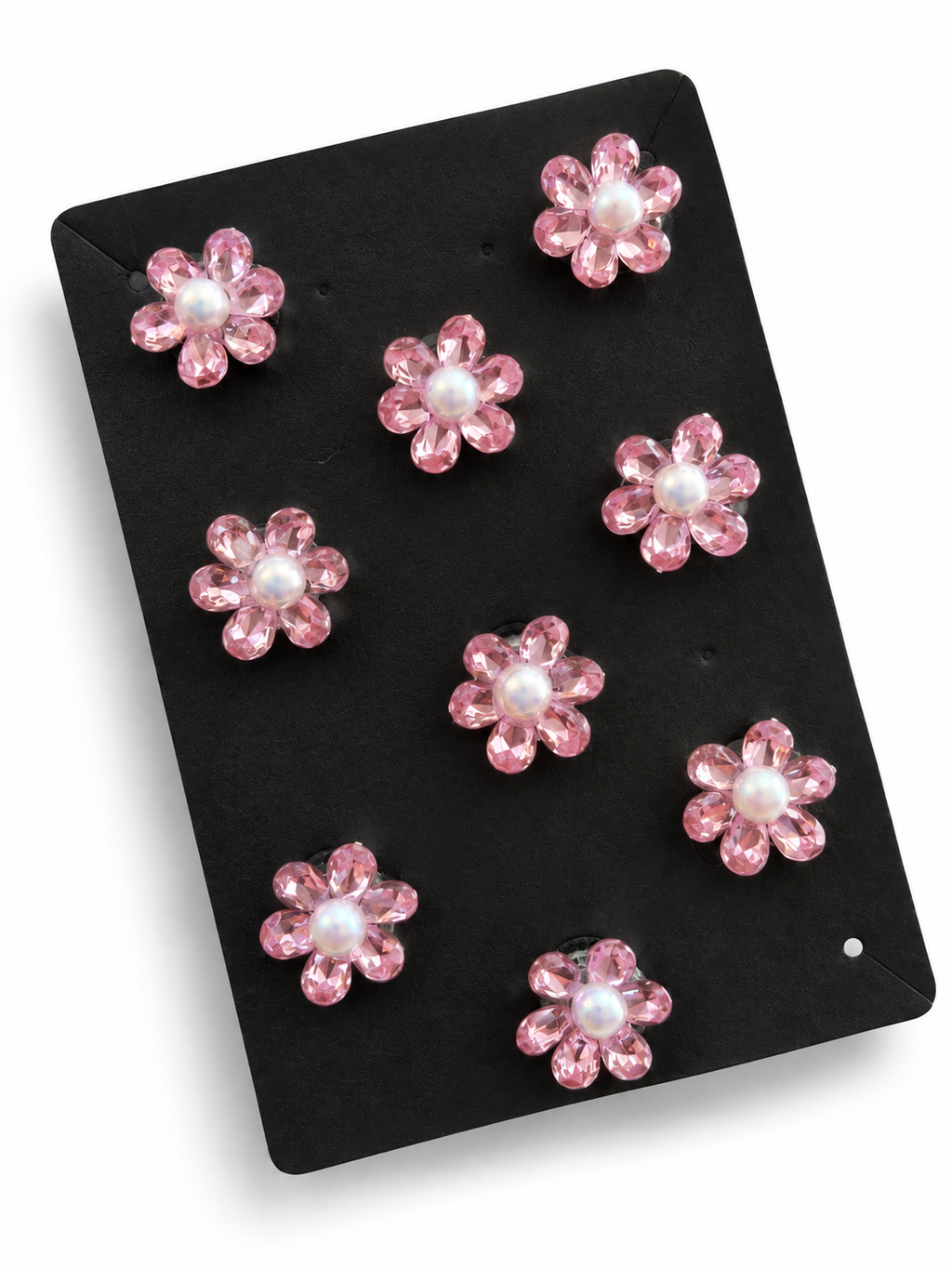 Pink crystal flower hair stickers with pearl-look centres on a black display card