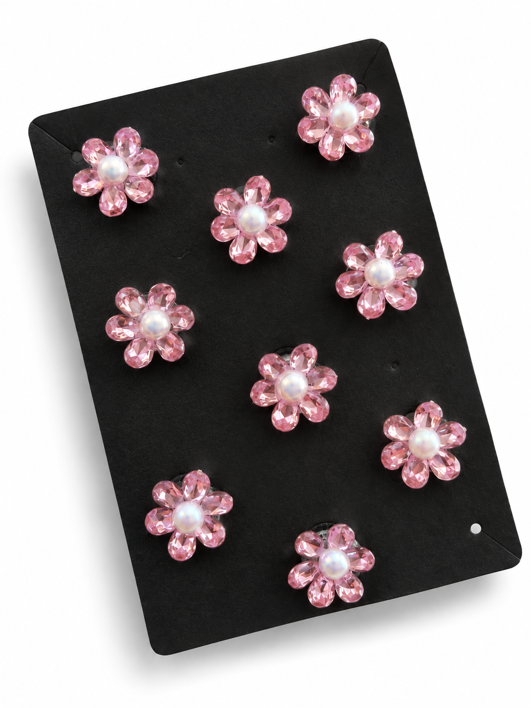 Pink crystal flower hair stickers with pearl-look centres on a black display card