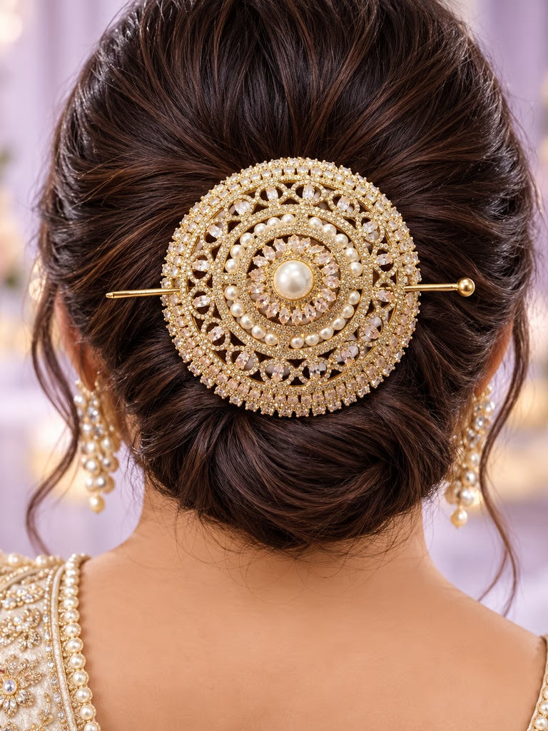 Royal gold-plated CZ and pearl bridal hair brooch styled in a traditional bun